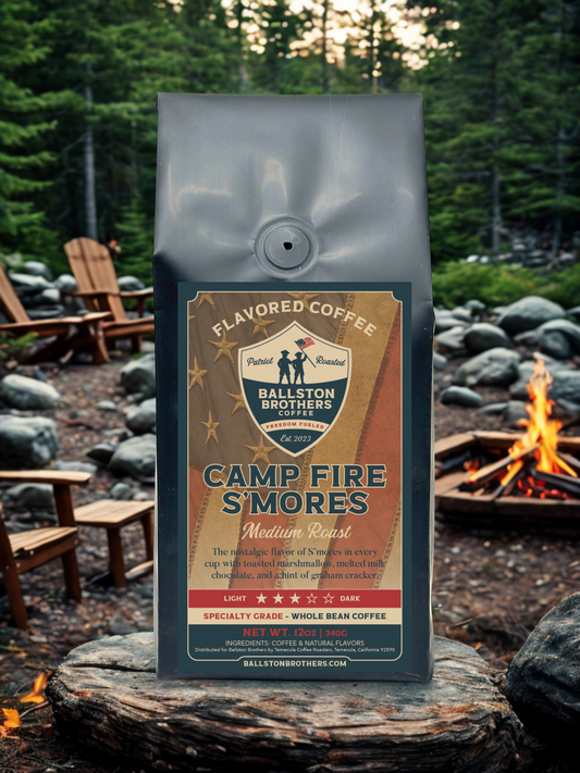 Bag of Ballston Brothers Coffee Camp Fire S'mores in a forest setting with a campfire.